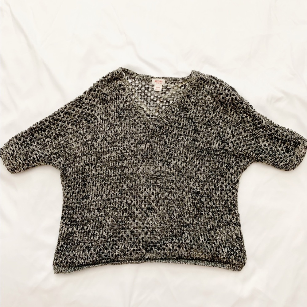 Black, white and grey knitted shirt.